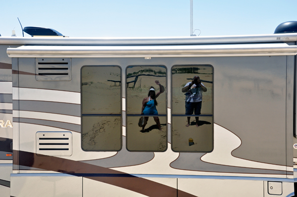 The reflection of the two RV Gypsies in the RV window